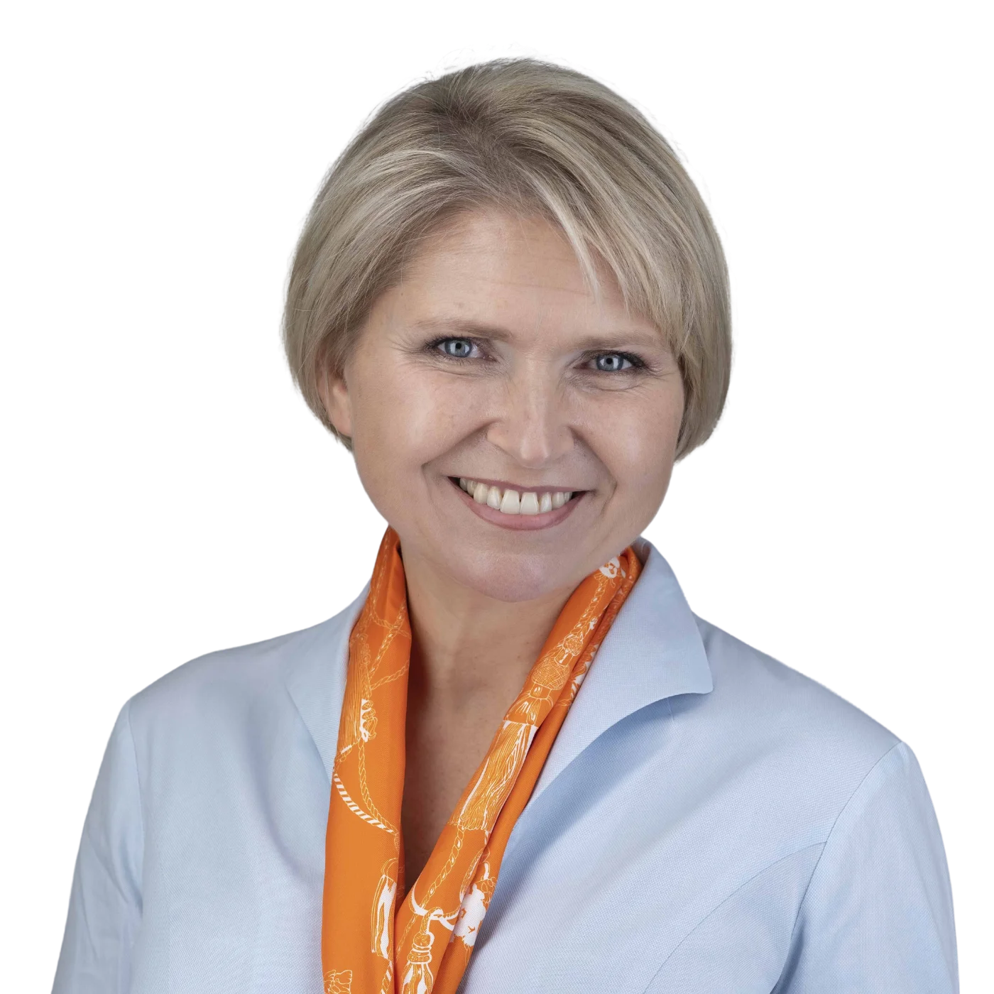 Corporate headshot of a smiling woman in a light blue shirt, by The Headshot Guy